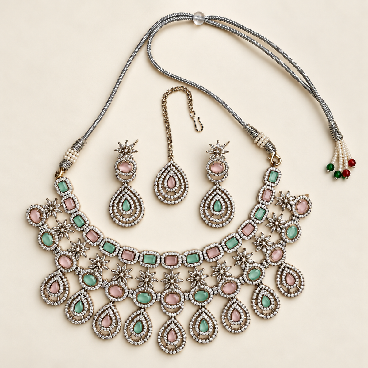 P03 mint and pink necklace, maang tikka and both earrings on ivory