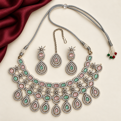 P03 complete necklace, maang tikka and both earrings with a partial burgundy cloth accent